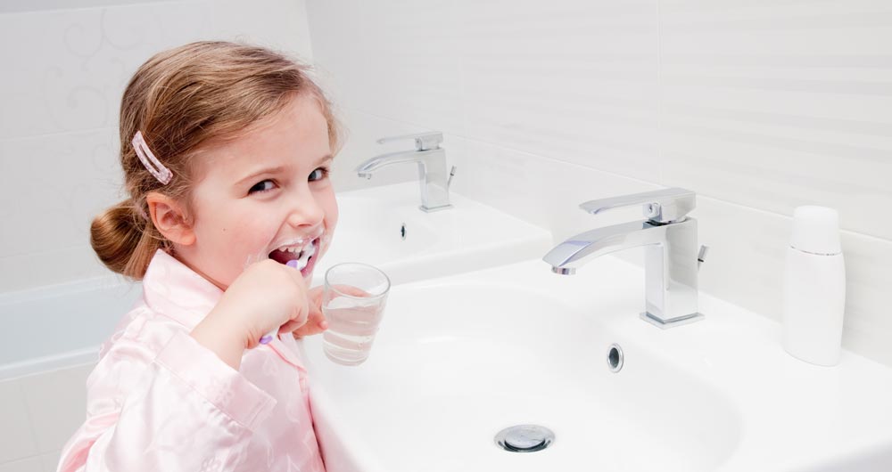 Child brushing teeth